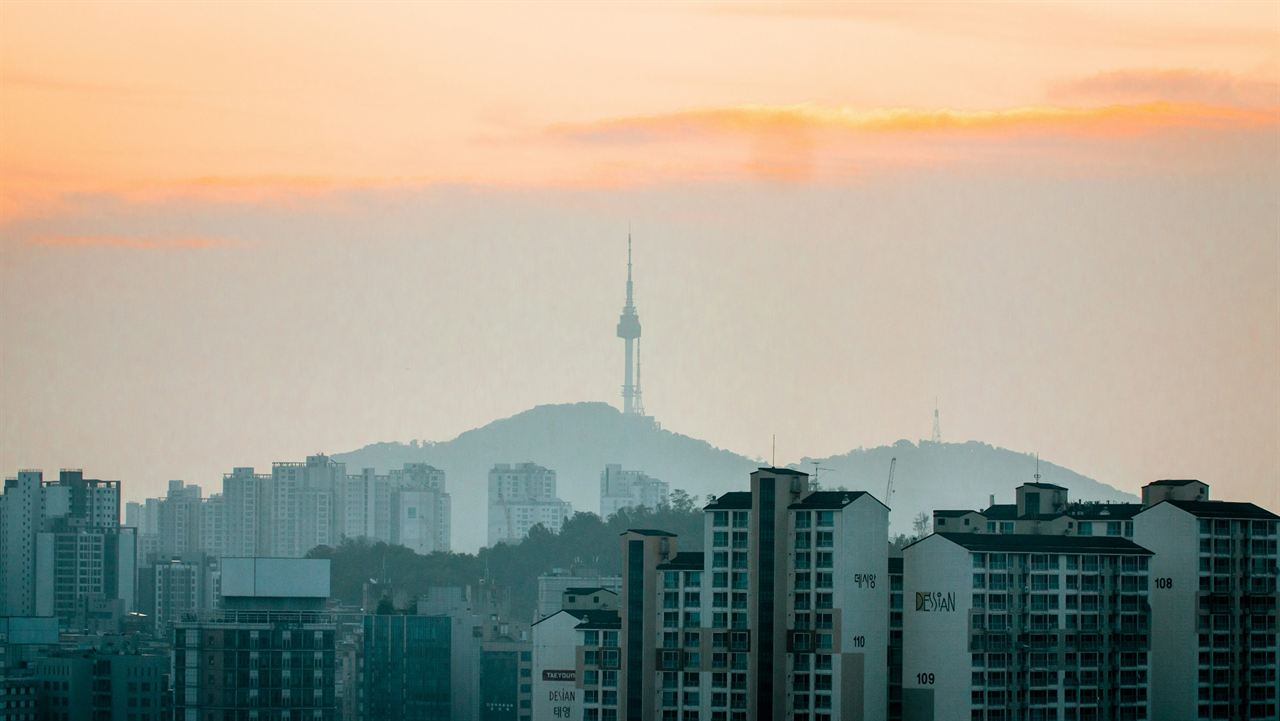 Seoul at dawn, with N Seoul Tower rising through the haze