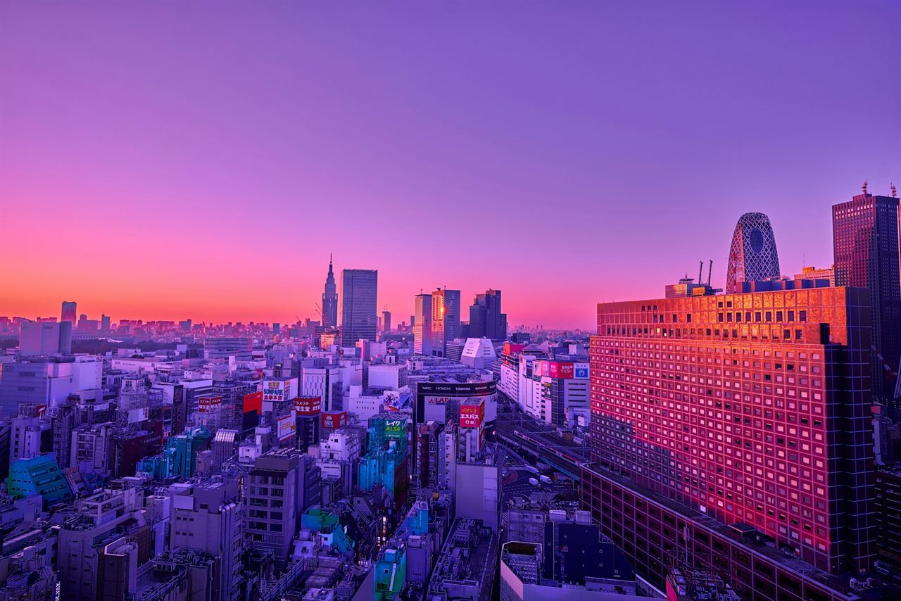 Tokyo’s skyline under a violet and orange sky